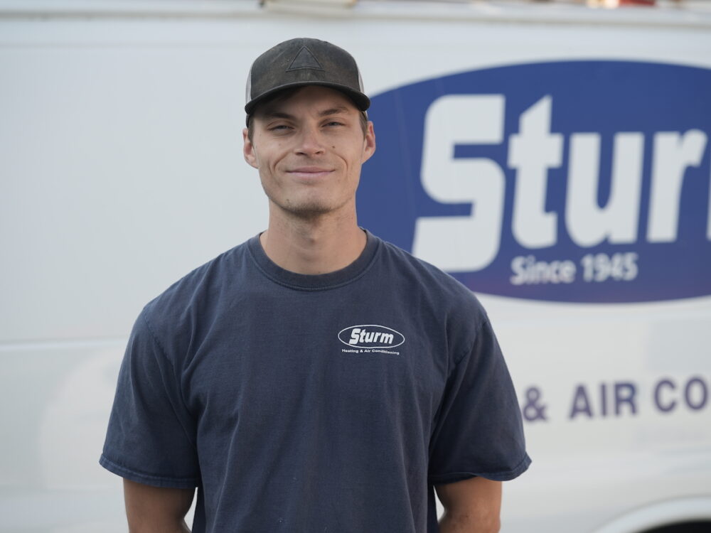 Sturm Technician in front of work van
